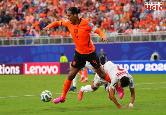 Dutch team; top spot in the World Cup knockout stage secured after defeating Tunisia.