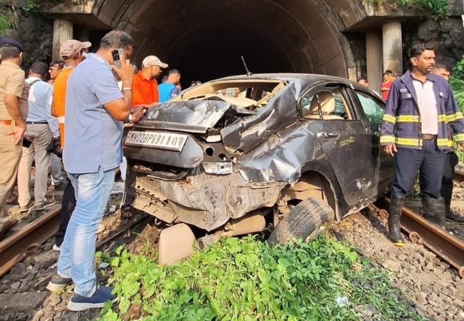 Car falls onto Belapur-Uran railway track, local train halted